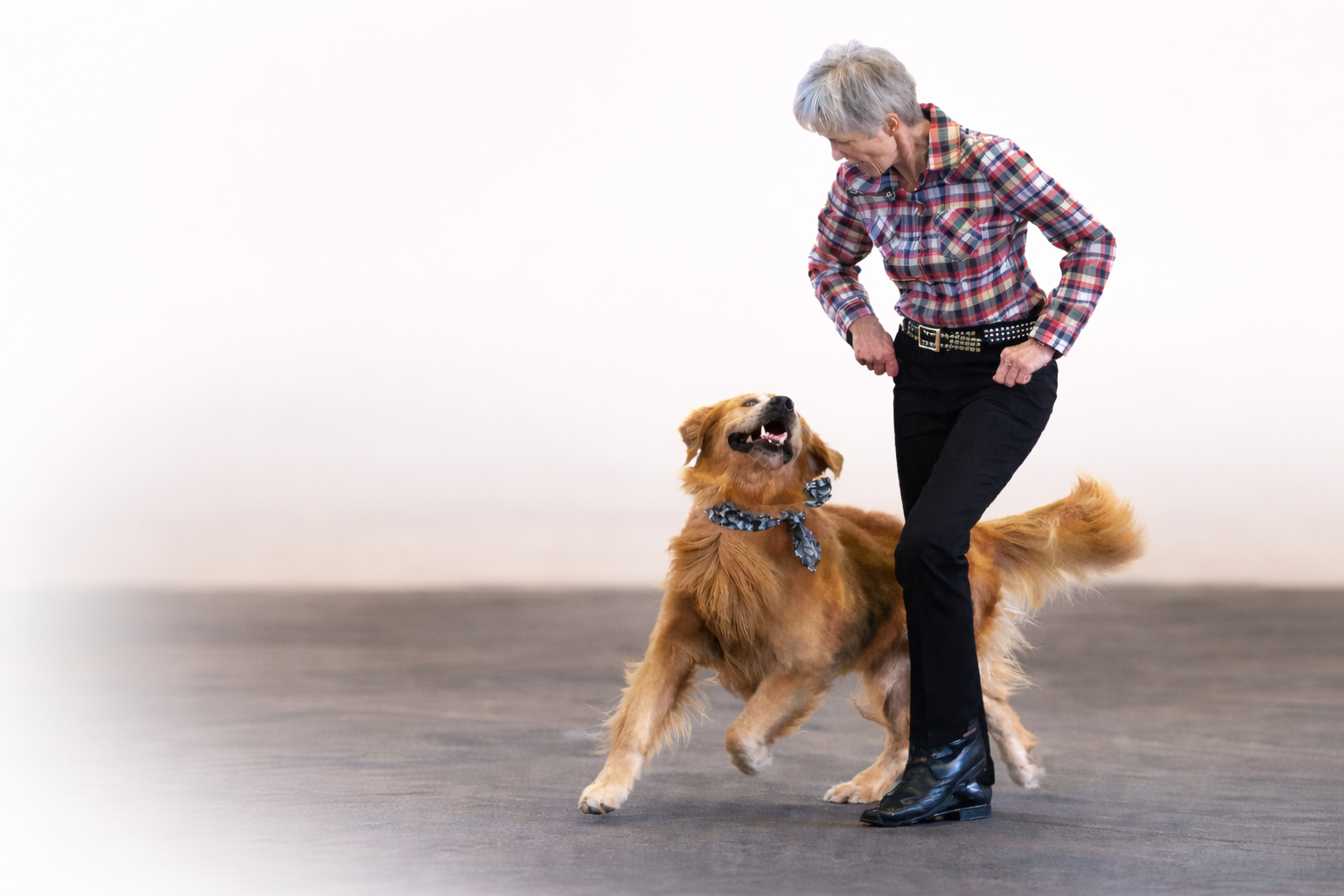 Handler dancing with their dog